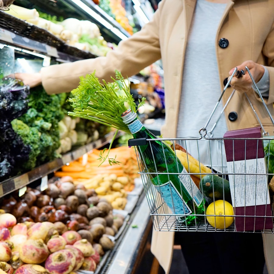 A person holding a shopping basket in a supermarket